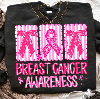 Black Shirt that has pink bows and a pink Breast Cancer Cross. Below is Breast Cancer Awareness written in Pink. 
